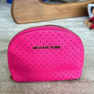 Beautiful and bright pink mini Michael Kors pouch for any use